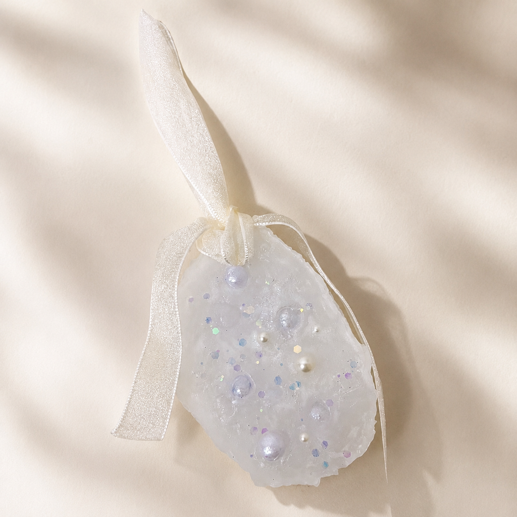 Handmade pearlescent scented wax sachet with ribbon and delicate decorative details from the Seasonal & Limited collection
