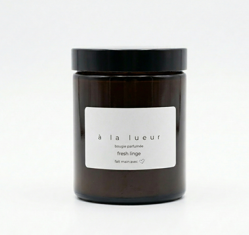 Amber soy candle in amber glass jar with black lid, scented in Fresh Linen
