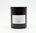 Amber soy candle in amber glass jar with black lid, scented in Fresh Linen