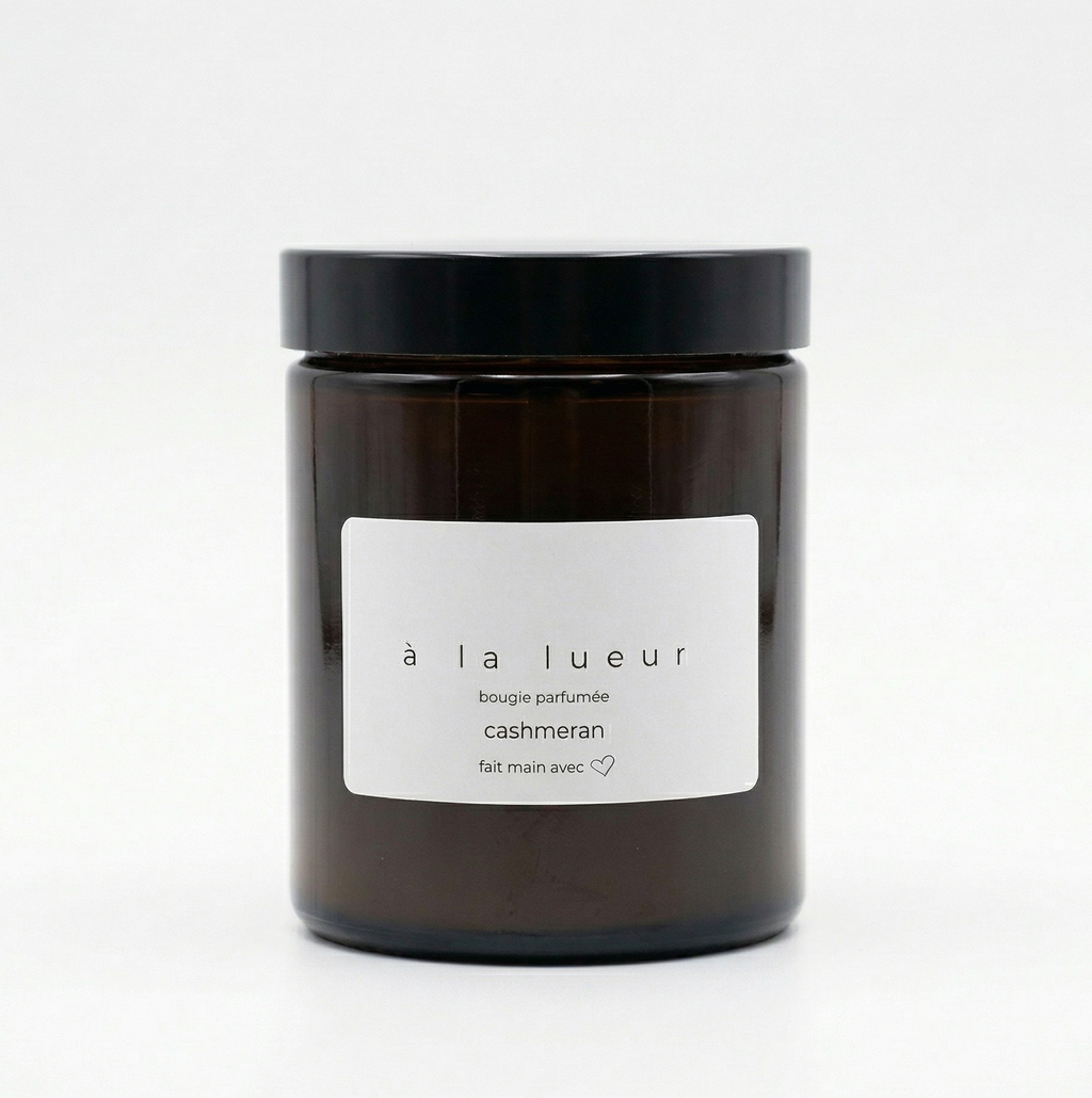 Amber soy candle in amber glass jar with black lid, scented with cashmeran