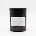 Amber soy candle in amber glass jar with black lid, scented with cashmeran